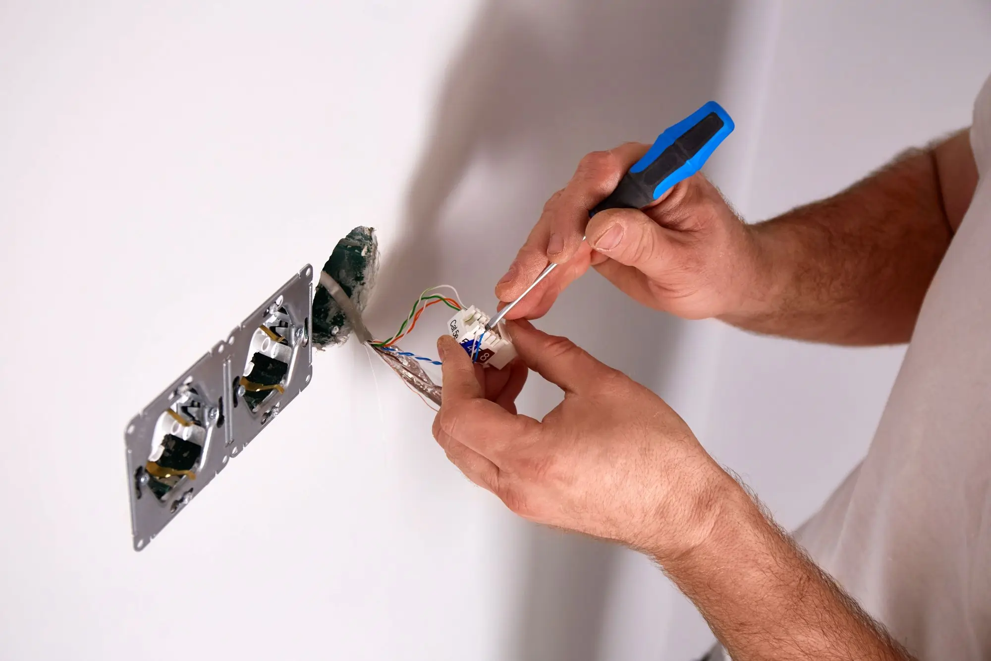 electrician upgrading electrical panel to reduce insurance risk and improve safety